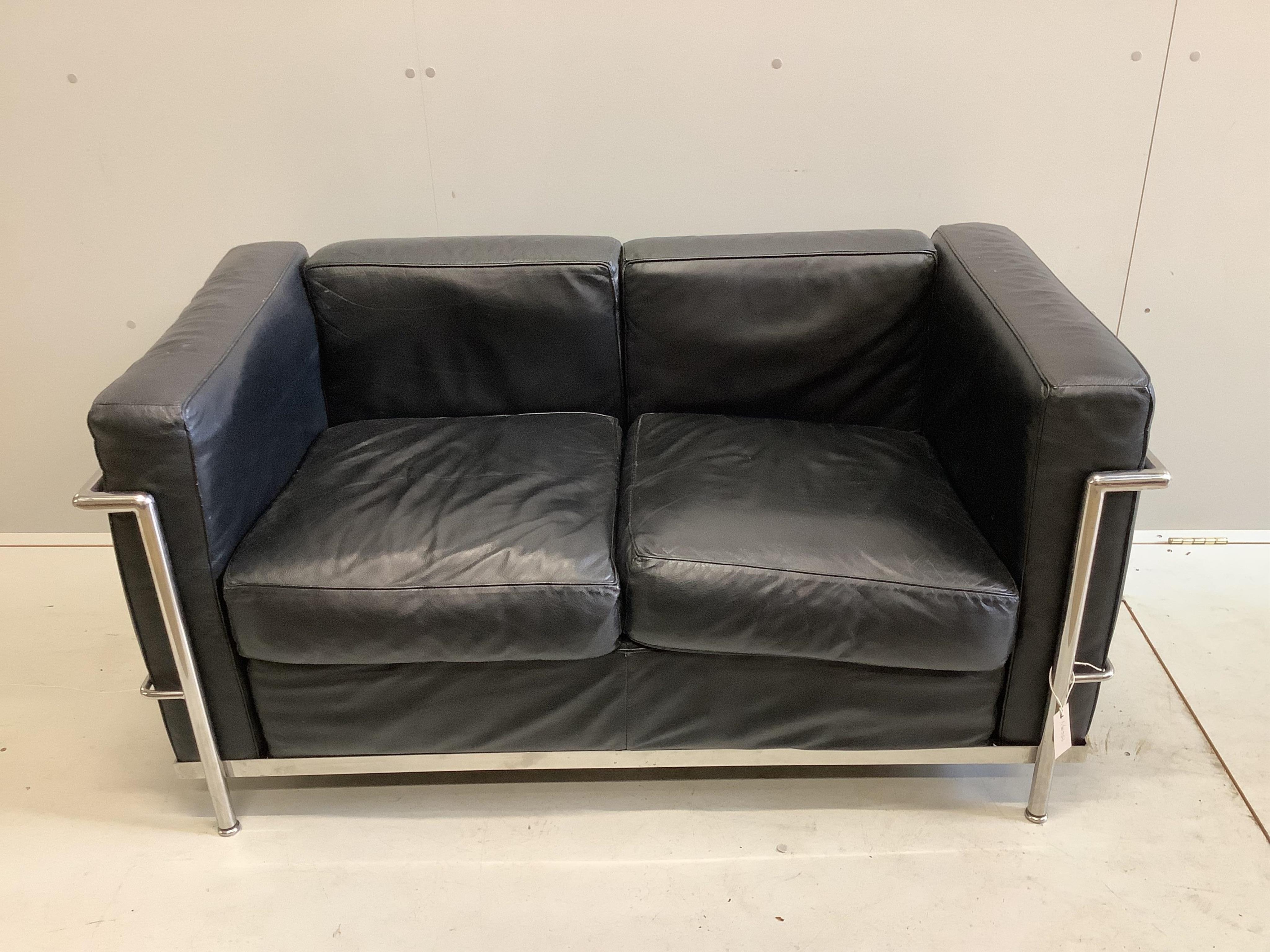 A Le Corbusier style two seater settee, width 130cm, depth 70cm, height 64cm. Condition - fair